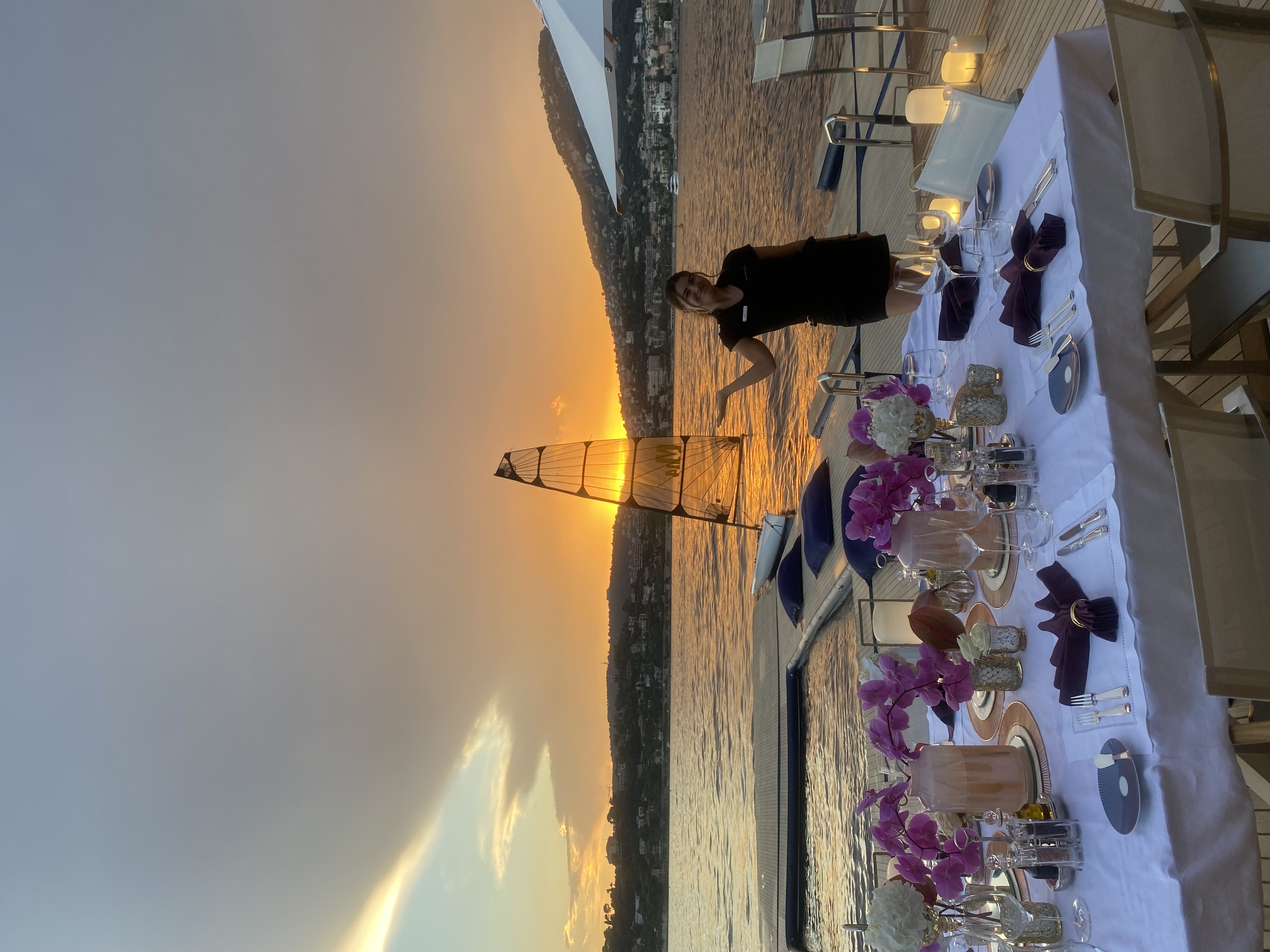 Holly doing table decoration on a yacht